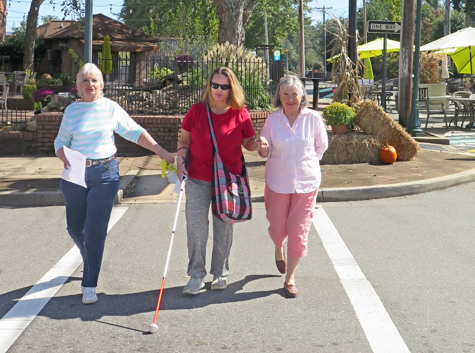 3 residents crossing street in Downtown Morganton